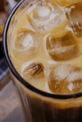 Refreshing hazelnut iced coffee served over ice with a garnish