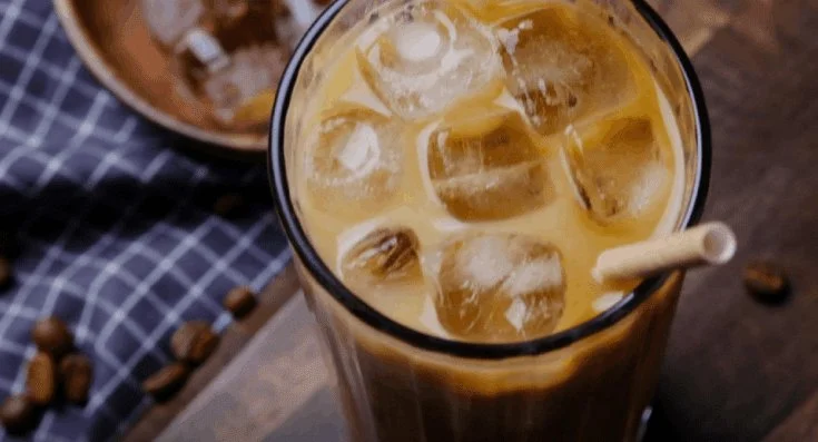 Refreshing hazelnut iced coffee served over ice with a garnish
