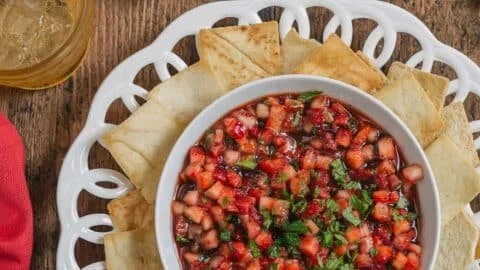Fresh strawberry salsa with balsamic glaze and herbs in a bowl