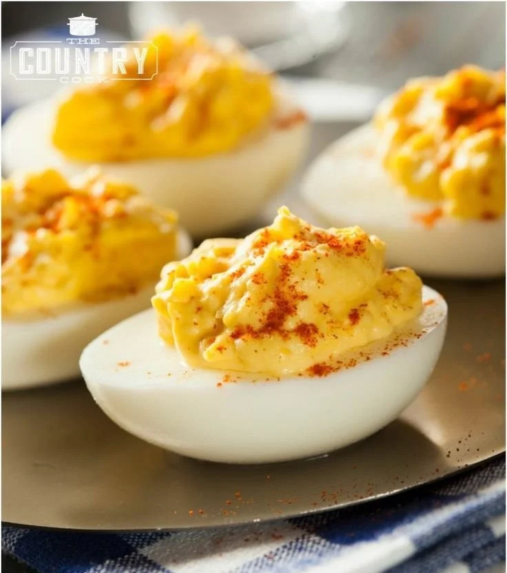 Delicious plate of the best ever deviled eggs garnished with paprika