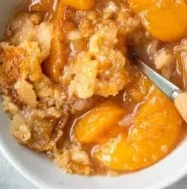 Southern peach cobbler with juicy peaches and a golden crust