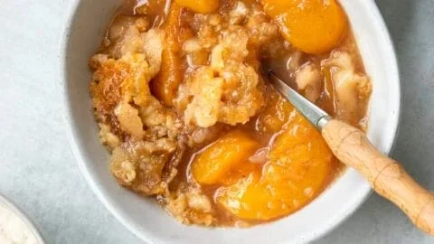 Southern peach cobbler with juicy peaches and a golden crust