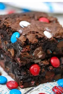Delicious homemade brownies on a cooling rack, showcasing a rich chocolate texture.