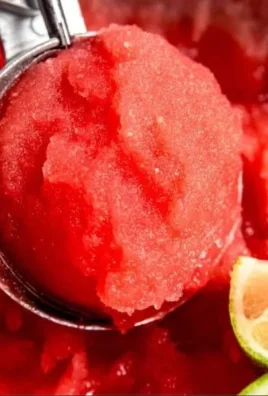 Bowl of refreshing watermelon sorbet garnished with mint leaves