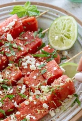 Delicious Watermelon Tajin Skewers served on a plate.