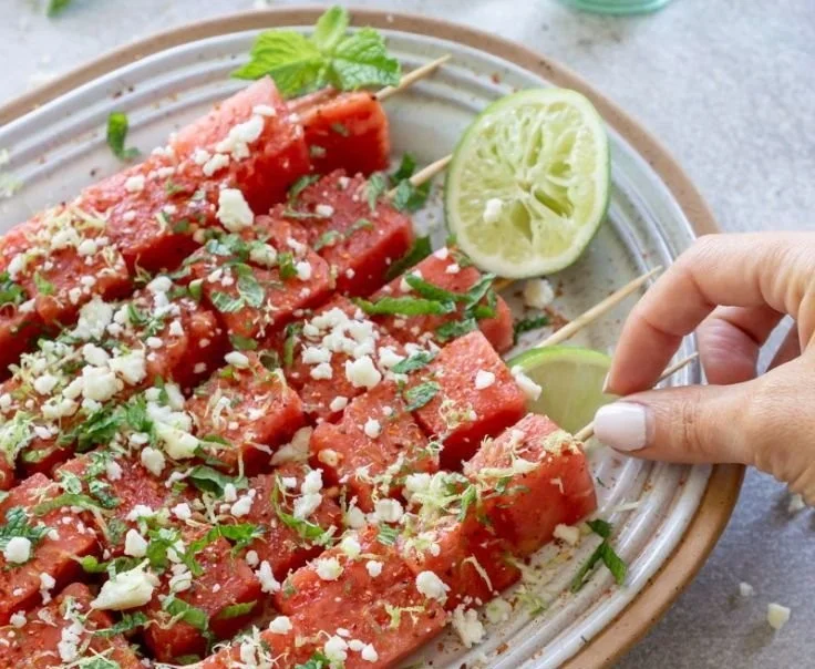 Delicious Watermelon Tajin Skewers served on a plate.