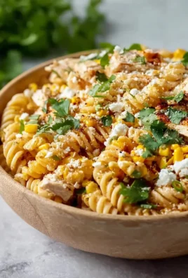 Zesty Mexican street corn chicken pasta salad in a vibrant bowl