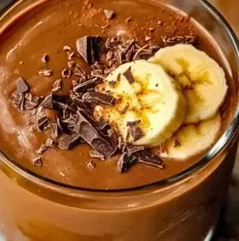 Almond Butter Banana Chocolate Smoothie topped with bananas and cacao nibs