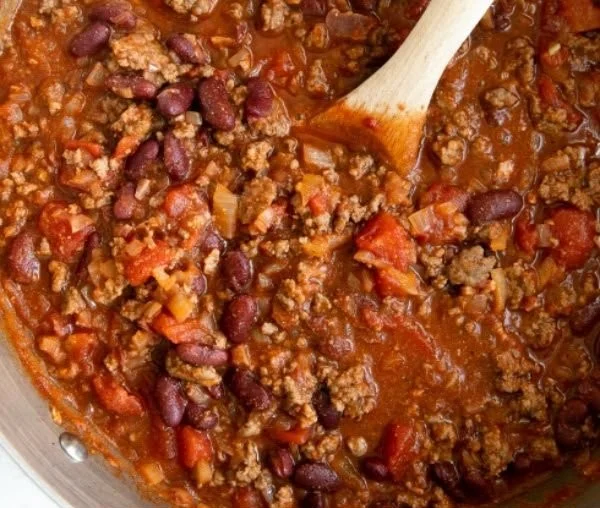 Delicious bowl of best chili recipe served with toppings