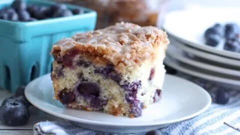 Delicious homemade blueberry coffee cake on a wooden table
