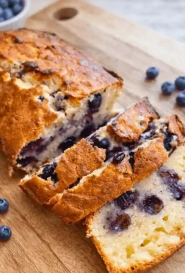 Delicious Blueberry Cream Cheese Loaf with fresh blueberries and cream cheese frosting