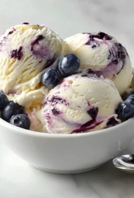 Cottage Cheese Blueberry Cheesecake Ice Cream topped with fresh blueberries