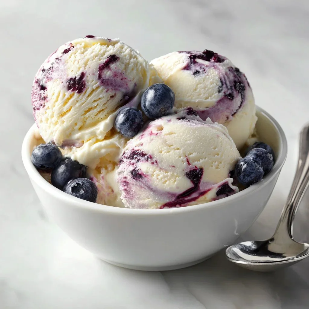 Cottage Cheese Blueberry Cheesecake Ice Cream topped with fresh blueberries