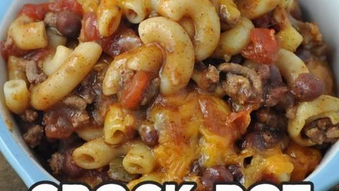 Crock Pot Cheddar Chili Mac with melted cheese and chili peppers in a bowl