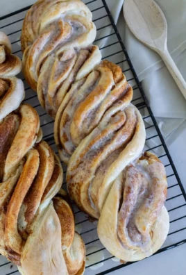 Easy cinnamon twist loaf freshly baked and drizzled with icing.