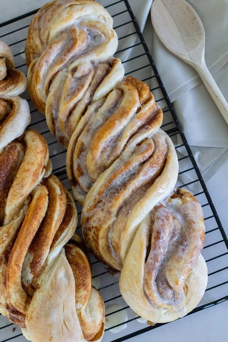 Easy cinnamon twist loaf freshly baked and drizzled with icing.