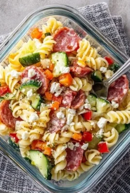 High-Protein Italian Pasta Salad with colorful vegetables and dressing