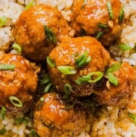 Delicious Honey Sriracha Meatballs coated in a spicy glaze