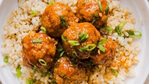 Delicious Honey Sriracha Meatballs coated in a spicy glaze