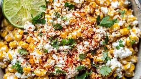 Delicious Mexican Street Corn topped with cheese and spices