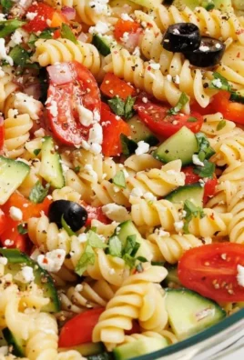 Colorful and fresh pasta salad with vegetables and dressing