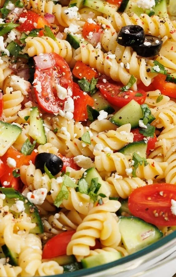 Colorful and fresh pasta salad with vegetables and dressing