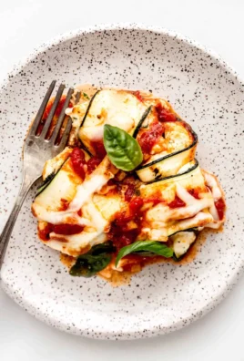 Delicious ricotta stuffed zucchini rolls served with marinara sauce