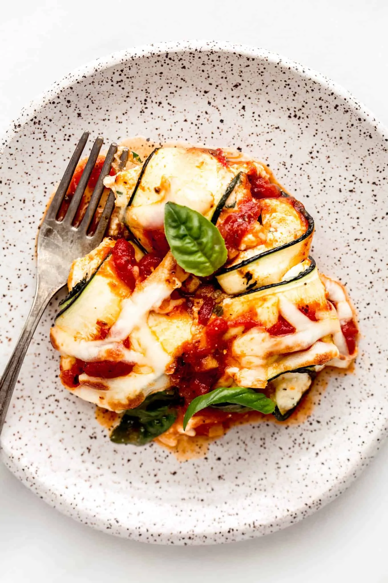 Delicious ricotta stuffed zucchini rolls served with marinara sauce