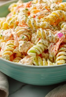 A bowl of simple crab pasta salad with vibrant vegetables and creamy ranch dressing