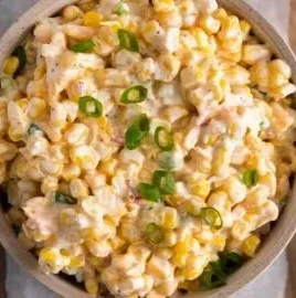 Bowl of delicious Southwest Corn Dip served with tortilla chips.