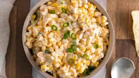 Bowl of delicious Southwest Corn Dip served with tortilla chips.