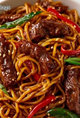 Delicious bowl of beef lo mein with tender noodles and glossy sauce