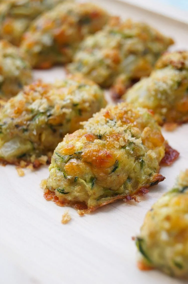 Plate of crispy Zucchini Tots served with dipping sauce